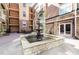 Exterior courtyard view with central fountain, patio seating, and building facade at 10 Ne Perimeter Summit Ne Blvd # 4428, Brookhaven, GA 30319
