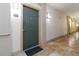 Interior hallway with tiled flooring leading to unit entrance at 10 Ne Perimeter Summit Ne Blvd # 4428, Brookhaven, GA 30319