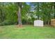 Large backyard with a storage shed, mature trees, and well-maintained lawn at 1788 Beacon Hill Ne Blvd, Atlanta, GA 30329