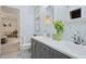 Bright bathroom featuring a double sink vanity, framed mirrors, and a view to the bedroom at 1788 Beacon Hill Ne Blvd, Atlanta, GA 30329