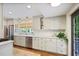Spacious kitchen featuring modern appliances, ample counter space, and natural light, and backyard patio at 1788 Beacon Hill Ne Blvd, Atlanta, GA 30329