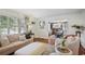 Cozy living room showcases open design to dining area, neutral tones, and hardwood floors at 1788 Beacon Hill Ne Blvd, Atlanta, GA 30329