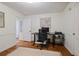 Bright office featuring a minimalist desk, hardwood floors, and white walls for a clean look at 1788 Beacon Hill Ne Blvd, Atlanta, GA 30329