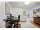 Office featuring hardwood floors, a sleek desk, and a calming view towards a hallway at 1788 Beacon Hill Ne Blvd, Atlanta, GA 30329