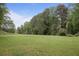 Expansive green lawn with mature trees, offering plenty of space for outdoor enjoyment at 1788 Beacon Hill Ne Blvd, Atlanta, GA 30329
