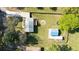 Aerial view of the property highlighting the house, backyard, detached garage, and firepit at 1961 Addison Ne Rd, Marietta, GA 30066