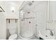 Cozy bathroom featuring tiled shower with glass door, modern fixtures, and tiled floors at 1961 Addison Ne Rd, Marietta, GA 30066
