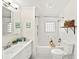 Well-lit bathroom featuring white subway tile, updated fixtures, and classic design at 1961 Addison Ne Rd, Marietta, GA 30066