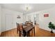 Inviting dining room with hardwood floors, modern decor, and access to adjacent rooms at 1961 Addison Ne Rd, Marietta, GA 30066