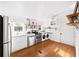 Bright kitchen featuring stainless steel appliances, white cabinetry, and wooden accents at 1961 Addison Ne Rd, Marietta, GA 30066