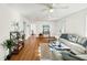 Sunlit living room boasts hardwood floors, a comfortable sofa, and tasteful decor at 1961 Addison Ne Rd, Marietta, GA 30066