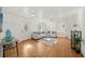 Inviting living room featuring hardwood floors, a ceiling fan, and stylish decor at 1961 Addison Ne Rd, Marietta, GA 30066