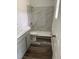 Well-lit bathroom featuring a modern shower, toilet, gray walls, and sink with a white countertop at 2919 Cushing Ct, Jonesboro, GA 30238