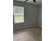 This cozy bedroom is brightened by a window with lovely outside views at 2919 Cushing Ct, Jonesboro, GA 30238