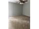 This empty bedroom has neutral colored walls and ceiling fan at 2919 Cushing Ct, Jonesboro, GA 30238