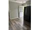 Bright kitchen features hardwood floors and a modern, black refrigerator near the back door at 2919 Cushing Ct, Jonesboro, GA 30238