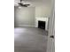 Cozy living room features a ceiling fan, modern fireplace, and a neutral color palette at 2919 Cushing Ct, Jonesboro, GA 30238