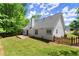 Well-maintained backyard featuring a spacious wooden deck, fenced yard and lush green lawn at 2880 Cressington Nw Bnd, Kennesaw, GA 30144