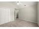 Bedroom featuring vaulted ceilings, carpeting, neutral walls, and closet storage at 2880 Cressington Nw Bnd, Kennesaw, GA 30144