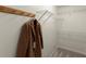 Walk-in closet with wire shelving, a wooden coat rack, and neutral carpeting at 2880 Cressington Nw Bnd, Kennesaw, GA 30144