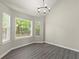 Cozy dining nook with three windows and new vinyl floors at 2880 Cressington Nw Bnd, Kennesaw, GA 30144
