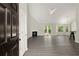 Spacious living room with vaulted ceiling, a fireplace, and new vinyl floors at 2880 Cressington Nw Bnd, Kennesaw, GA 30144