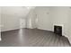 Open-concept living space with new flooring, vaulted ceilings, fireplace, and lots of natural light at 2880 Cressington Nw Bnd, Kennesaw, GA 30144