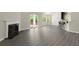 Open-concept living room with fireplace, bar seating and sliding doors to the outdoor living space at 2880 Cressington Nw Bnd, Kennesaw, GA 30144