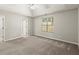 Bright main bedroom features tray ceilings, neutral walls, plush carpet and generous natural light at 2880 Cressington Nw Bnd, Kennesaw, GA 30144