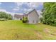 Well-maintained backyard slopes towards the house with a walkout basement at 51 Legend Creek Way, Douglasville, GA 30134