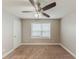 A cozy bedroom is shown with neutral colored walls and a ceiling fan for comfort at 51 Legend Creek Way, Douglasville, GA 30134