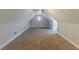 Spacious carpeted bonus room with a ceiling fan and natural light at 51 Legend Creek Way, Douglasville, GA 30134