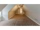 A sprawling carpeted bonus room illuminated by a ceiling fan and recessed lighting at 51 Legend Creek Way, Douglasville, GA 30134