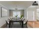 Staged dining room featuring stylish decor and comfortable seating for elegant entertaining at 51 Legend Creek Way, Douglasville, GA 30134