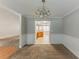 An empty dining room showing easy access to the kitchen, ready for Gathering dinners at 51 Legend Creek Way, Douglasville, GA 30134