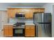 Contemporary kitchen featuring stainless steel appliances, light wood cabinets, and updated fixtures at 51 Legend Creek Way, Douglasville, GA 30134