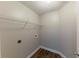 A functional laundry room with wood floors and wire shelving at 51 Legend Creek Way, Douglasville, GA 30134