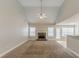 Open-concept living room with a fireplace, ceiling fan, and access to the outdoors at 51 Legend Creek Way, Douglasville, GA 30134