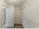 A functional walk-in closet with shelving for optimal storage at 51 Legend Creek Way, Douglasville, GA 30134