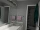 The bathroom features a sink, mirror, vanity lights and a separate shower-tub room at 6192 Meadowbrook Dr, Norcross, GA 30093