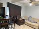 A living room features a sofa, chair, table, and television; a ceiling fan is also visible at 6192 Meadowbrook Dr, Norcross, GA 30093