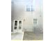The backyard features double doors, a window and an air conditioning unit at 6318 Scudders Dr, Lithonia, GA 30058
