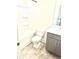 Clean bathroom with a shower-tub combo, grey vanity, and patterned flooring at 6318 Scudders Dr, Lithonia, GA 30058