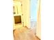 Hallway view of bathroom with vanity and access to bedroom at 6318 Scudders Dr, Lithonia, GA 30058