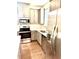 Modern kitchen featuring stainless steel appliances and gray cabinets with light countertop at 6318 Scudders Dr, Lithonia, GA 30058