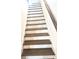 View of staircase with dark treads and white risers, complemented by wooden railing at 6318 Scudders Dr, Lithonia, GA 30058