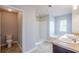 Well-lit bathroom with walk-in shower, soaking tub, and double sink vanity at 1003 Eldon Ln, Fairburn, GA 30213