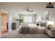 Staged bedroom with neutral walls, carpet, ceiling fan, and stylish decor at 1003 Eldon Ln, Fairburn, GA 30213