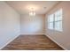 Bright entryway with wood-look floors, a chandelier, and neutral paint at 1003 Eldon Ln, Fairburn, GA 30213