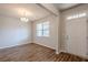 Inviting entryway with wood-look floors, a chandelier, and a white front door at 1003 Eldon Ln, Fairburn, GA 30213